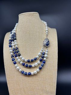 Something blue necklace: white glass pearls and lapis lazuli combined with rhinestone and with silver colored pewter and lapis lazuli peacock detail. 3 strands. Great for wedding or formal events. Free shipping. Elegant Lapis Lazuli Necklace With Polished Beads, Elegant Lapis Lazuli Beaded Necklace, Elegant Silver Beaded Lapis Lazuli Necklace, Elegant Blue Lapis Lazuli Crystal Necklace, Silver Lapis Lazuli Beaded Necklace, Blue Necklace, Something Blue, Black Diamond, Lapis Lazuli