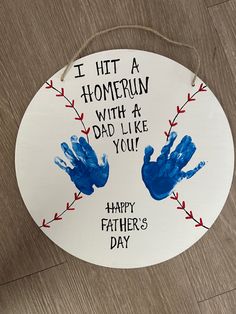 a father's day sign with handprints on it