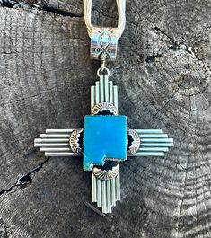 Charlene Yazzie Zia symbol pendant. Offered in Agave Green, Blue, and White Buffalo. Made right here in New Mexico! made with .925 silver and Native American Handmade. Sterling Silver Medallion With Polished Finish, Polished Sterling Silver Medallion Jewelry, Sterling Silver Medallion Jewelry With Polished Finish, Blue Symbolic Nickel-free Jewelry, Symbolic Blue Nickel-free Jewelry, Sterling Silver Engraved Square Pendant, Engraved Sterling Silver Square Pendant, Blue Medallion Jewelry With Polished Finish, Symbolic Sterling Silver Pendant Jewelry