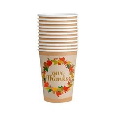 a stack of coffee cups with the words give thanks written on them in gold and orange leaves