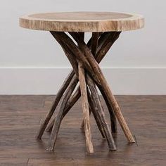 a table made out of wood sticks on a wooden floor