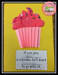 a cupcake with pink frosting and sprinkles on it next to a sign that says if you give a cupcake, he'll want to go with it