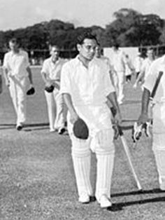 black and white photograph of men in cricket uniforms