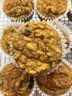 several muffins sitting on top of a cooling rack