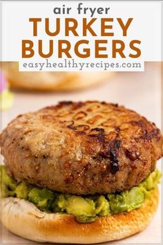 an air fryer turkey burger with guacamole and avocado on it