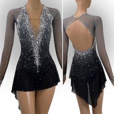 the back of a black and silver figure skating dress