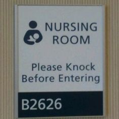 a sign on the wall that says nursing room please knock before entering b222 6