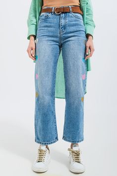 Reminiscent of the 1990s, these adorable mom jeans boast of eye-catching glitter hearts that cascade down the side of the legs. They are high-waisted, with straight legs, five pockets, a zip fastening, and belt loops. The belt in the photos is not included. The rigid, non-stretch denim fabric is made from 100% Cotton. In our photos, we pair these jeans with our Rib Crop Top in Beige and our Cotton Oversized Shirt in Green. The model is 5’8” with measurements of 33-24-35 and is wearing a size sma Types Of Jeans, Stretch Denim Fabric, 90s Looks, Ribbed Crop Top, Girls Denim, Knitwear Tops, Oversized Shirt, Heart Print, Denim Fabric