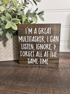 a wooden sign that says i'm a great multitasker, i can listen ignore forget all at the same time