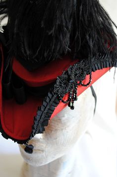 This gorgeous gothic mini tricorn is covered with bright red silk shantung and adorned with black elements. A striking black ostrich feather stands gloriously at the back, while tiny black crystals add just enough sparkle! An elegant black rose gracefully adorns the side back of the hat, sitting among black taffeta bows and lace while the back is playfully embellished with a beaded bow. Please take a closer look to the pictures in order to appreciate all the tiny details of this beauty! Select b Gothic Mini Hats For Carnival Costume, Vintage Red Hats For Costume Party, Vintage Red Hat For Costume Party, Gothic Curved Brim Mini Hats For Costume, Gothic Mini Hat With Curved Brim For Costume, Gothic Red Costume Hats And Headpieces For Costume Party, Handmade Red Costume Hats And Headpieces, Red Gothic Costume Accessories For Carnival, Red Costume Hats For Carnival