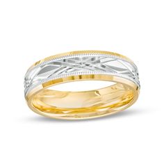 two tone gold and silver wedding band with an intricate design on the inside of it