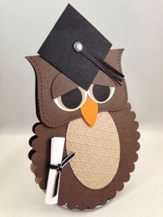 an owl with a graduation cap on its head