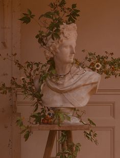 a statue with flowers on top of it