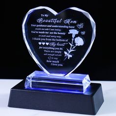 a heart shaped glass award with a poem on it