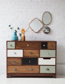 an old dresser has been transformed into a modern chest of drawers with paint and hardware