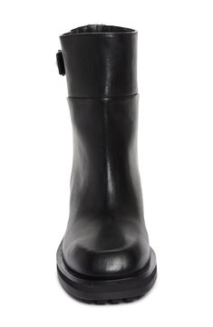 This round-toe boot is an elevated take on the classic biker style in shiny calfskin leather with a geometric buckle and faux back zip. An adjustable strap and lugged sole add to the rugged character. 1 3/4" (44mm) heel; 3/4" platform (size 36.5) 7" shaft; 13" calf circumference Pull-on style with faux back zip Leather upper and lining/rubber sole Made in Italy Designer Shoes Modern Calf Leather Moto Boots For Work, Modern Ankle Moto Boots In Calf Leather, Modern Calf Leather Ankle Moto Boots, Leather Ankle Moto Boots For Riding, Rollerball Perfume, Rounded Toe Boots, Favorite Daughter, Low Block Heels, Biker Style