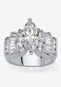 a white gold ring with an oval cut diamond surrounded by baguettes