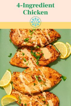 grilled chicken on a green plate with lemons and parsley