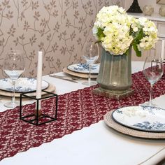 the table is set with white and blue dishes