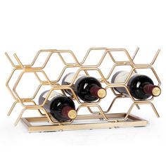 the wine rack is made out of metal and holds six bottles, including one for each bottle