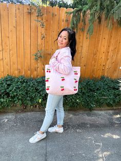 "The cutest pink cherry tote bag is here! Perfect to take with you to the farmers market or grocery shopping. Please note that the cherries are only on one side of the bag. The bag measures 20\"W x 15\"H x 5\"D and is made of 100% heavy cotton canvas. This bag is boxy on the bottom, so you can lay your items flat inside. ♥ Check out all my tote bags here https://www.etsy.com/shop/LeeMorganDesigns?ref=seller-platform-mcnav&section_id=38820830 ♥ VISIT THE MAIN SHOP PAGE ♥ https://www.etsy.com/shop/leemorgandesigns Lee Morgan Designs LLC, 2018 Thank you for visiting my shop! Find me on social media Facebook: https://www.facebook.com/leemorgandesigns/ Instagram: https://www.instagram.com/leemorgandesigns/" Pink Cotton Shoulder Bag For Spring, Spring Pink Cotton Shoulder Bag, Trendy Pink Bag With Strawberry Print, Trendy Pink Strawberry Print Bag, Rectangular Summer Grocery Shopping Bags, Rectangular Grocery Shopping Bag For Summer, Summer Grocery Tote Bags, Pom Pom Tote Bag, Lee Morgan