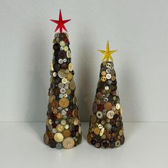 two small christmas trees made out of buttons