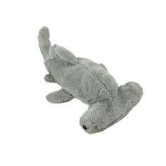 a gray stuffed animal laying on its side