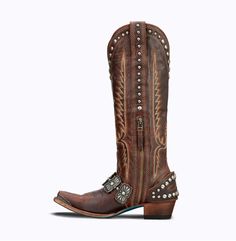 It doesn’t take a sharp shooter to see that the Silver Mesa Bootie hits every mark. Dangerous desire emerges from the stonewashed dust, highlighting graduating nail-head studs that outline thick flame-stitch embroidery. A full side zip fastens the harness with old pawn inspired conchos that set the stage with a turquoise center enveloped in hand stamping. A stylized toe guard caps off the piece and each step feels a little more powerful than the last. Heel Height: 1.75" Shaft Height: 7.5" Ankle Cognac Shoes, Sharp Shooter, Lane Boots, Leather Western Boots, Western Boots Women, Nail Head, The Arch, Cute Fit, Stitch Embroidery