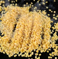 corn kernels are being cooked in a skillet