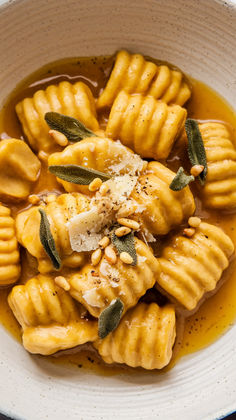 Homemade pumpkin gnocchi with sage butter sauce, featuring fluffy gnocchi pumpkin, easy gnocchi recipe perfect for fall, and a rich, aromatic gnocchi sauce. Ideal for a pumpkin recipes dinner with pumpkin potato gnocchi or pumpkin puree gnocchi. Discover how to make gnocchi recipes homemade, including ricotta gnocchi, for a cozy, delicious meal. Homemade Butternut Squash Gnocchi, Thanksgiving Gnocchi, Gnocchi Olive Garden, Sweet Potato Gnocchi Sauce, Gnocci Meals Gnocchi Recipes, Pumpkin Gnocchi Recipes, Vegan Gnocchi Recipes, Gnocchi Meals