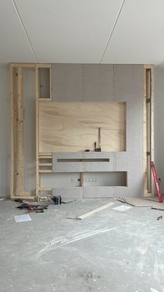 an unfinished room is shown with construction materials