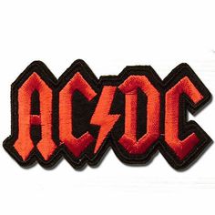 an embroidered patch with the word ac dc on it