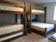 there are two bunk beds in the room with no mattresses on top of them