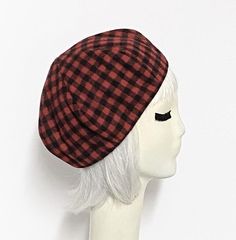 Red & black checkered vintage wool beret hat, lined in rayon print, the top of the hat is made up of 6 section crown, wool bias 1" fitted band and !' soft elastic band inside. One size fits most up to a 22" head size Made in the USA Dry Clean Vintage Fitted Beanie Hat, Adjustable Plaid Hat For Fall, Adjustable Plaid Flat Cap, Plaid Cap One Size Fits Most, Retro Adjustable Beret For Fall, Adjustable Retro Beret For Fall, Retro Adjustable Flat Cap Beret, Adjustable Retro Flat Cap Beret, Adjustable Retro Style Flat Cap Beret