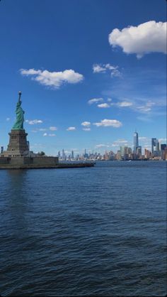 the statue of liberty is in new york city's lower east side as seen from across the water