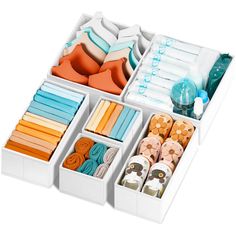 an organized drawer filled with lots of different items in it's trays and drawers