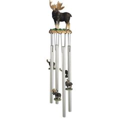 a metal wind chime with an animal on top