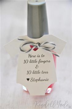 there is a bottle with a tag on it that says here is to 10 little fingers and 10 little toes stephanie