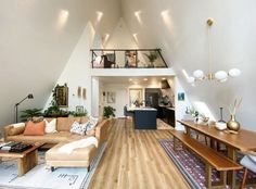 a living room filled with furniture next to a wooden floor