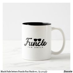 a white and black coffee mug with the word funcle on it