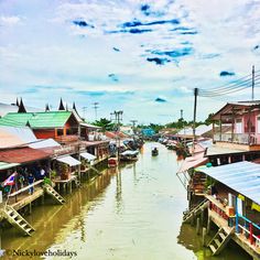 a waterway with houses and boats in the water