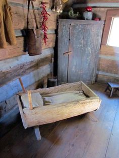 an old wooden bed in a rustic cabin