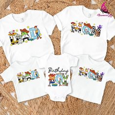 three baby onesuits with cartoon characters on them