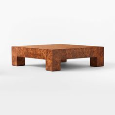 a wooden coffee table with two legs on the top and one leg raised to the side