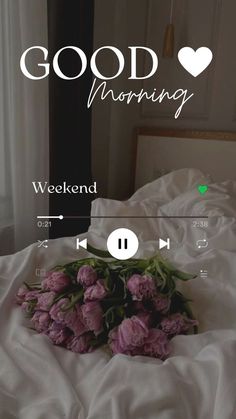 a bed with pink flowers on it and the words good morning