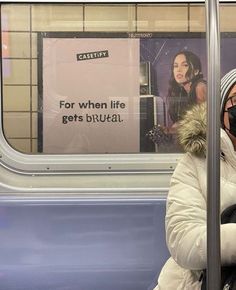 a woman wearing a face mask on a train