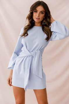 You've never looked better, all wrapped up in our Rapt dress. Featuring long bishop sleeves, soft ribbed fabric, mini length skirt and flattering adjustable waist-tie at the front to give you the perfect curvy silhouette from behind. Team it with nude heels and gold hoop earrings. Graduation Dress Long Sleeve, Light Blue Short Dress, Hot Party Dresses, Bishop Sleeve Dress, Selfie Leslie, Bishop Sleeve, Clothing Tags, Basic Dress, Dress Long Sleeve