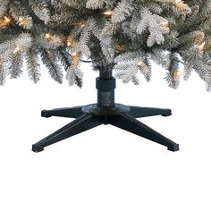 a christmas tree with white lights on it's branches and black stand against a white background