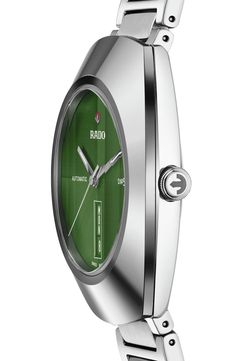 A polished Ceramos™ bezel frames the brushed green dial on this sleek, classic automatic watch that's further distinguished by a faceted sapphire-crystal face. This timepiece is crafted with Rado's R764 automatic movement with anitimagnetic Nivachron™, offering 80 hours of power reserve. 38mm case; 12.1mm case depth Deployant clasp closure Three-hand Swiss automatic movement with 80-hour power reserve Date function Super-LumiNova hands Water-resistant to 10 ATM (100 meters) Stripe-faceted sapphi Green Watches With Rectangular Dial And Analog Display, Modern Green Watch With Rectangular Dial, Green Formal Watch With Date Display, Formal Green Watch With Date Display, Timeless Green Watch With Date Display, Modern Green Quartz Watches, Timeless Green Watch With Analog Display, Green Watch With Polished Finish And Round Dial, Timeless Green Analog Watch