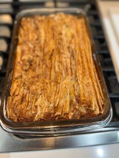 a casserole dish sitting on top of an oven